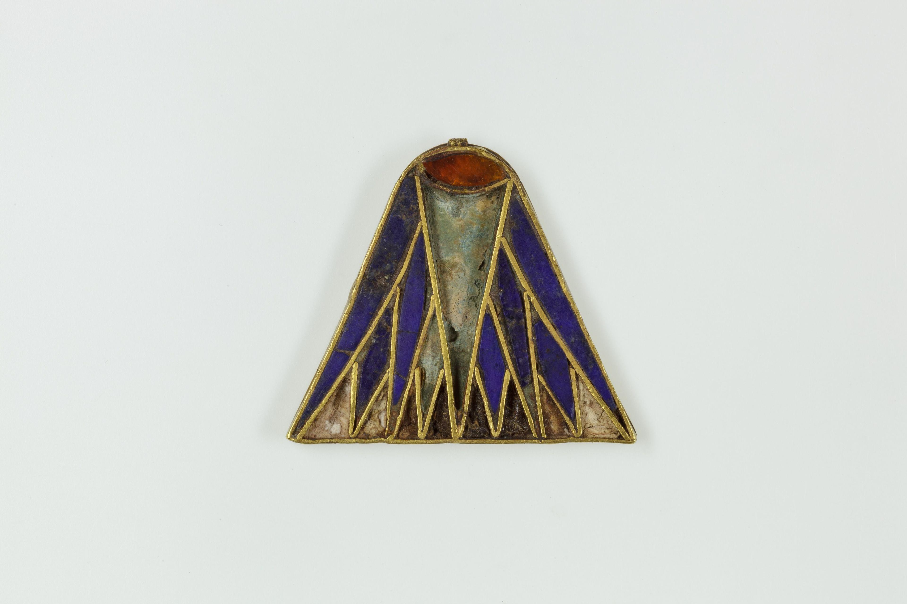 Ancient Egyptian lotus pendant with lapis lazuli inlay