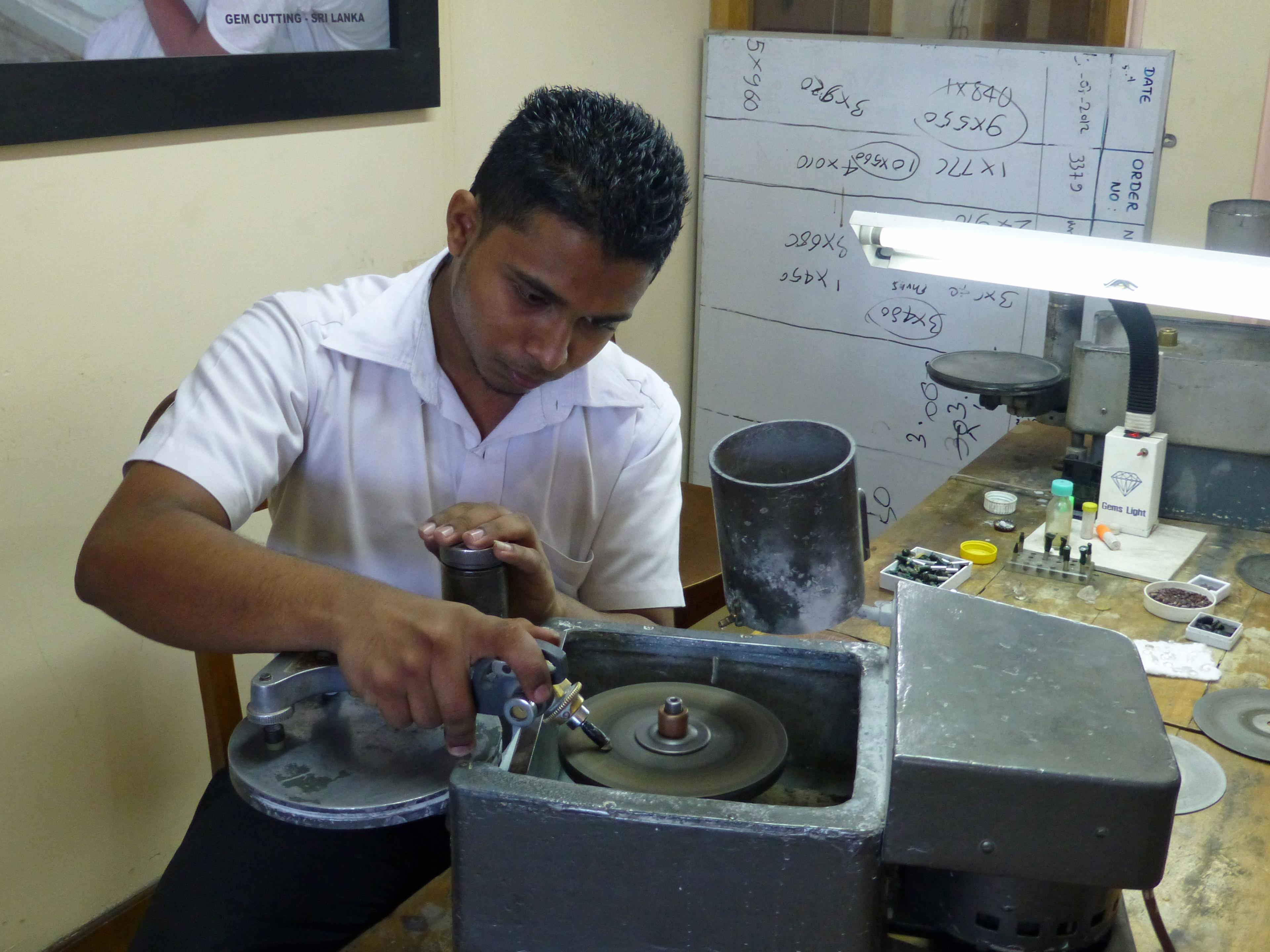 A gem cutter working at a faceting machine in Sri Lanka.